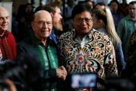 U.S. Commerce Secretary Wilbur Ross shakes hands with Indonesia's Chief Economic Minister Airlangga Hartarto after their meeting in Jakarta