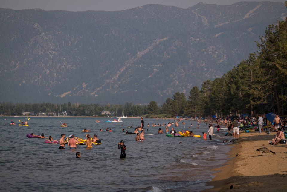 File: People visit Pope Beach in South Lake Tahoe, California.