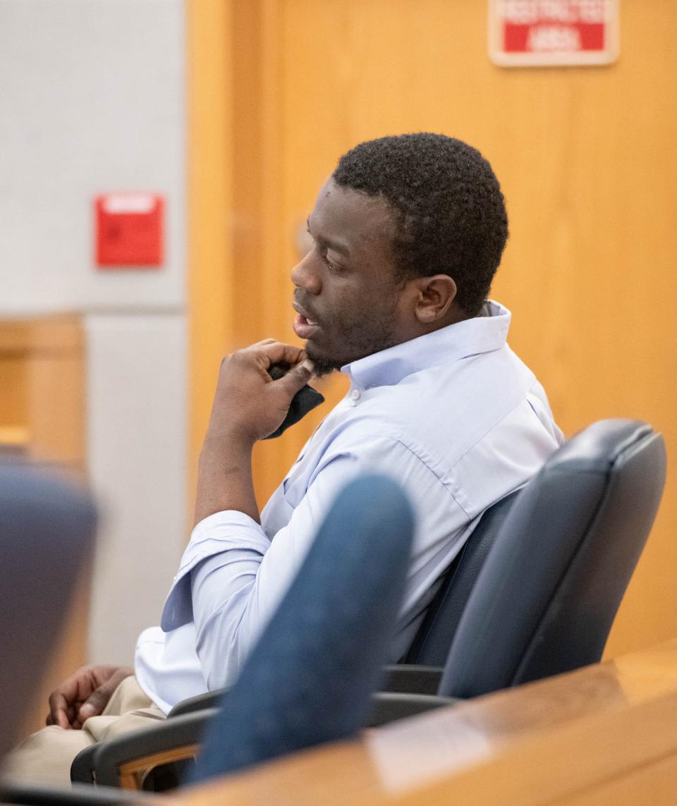 Michael Henderson Jr. listens during his trial in court at the M.C. Blanchard Judicial Building in Pensacola on Friday, March 15, 2024. Henderson is on trial for attempted second-degree murder.
