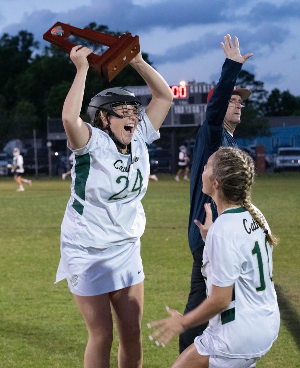 The Crusaders celebrate their 19-3 victory in the South Walton vs Catholic girls District 1-1A championship lacrosse game at Pensacola Catholic High School on Thursday, April 13, 2023.