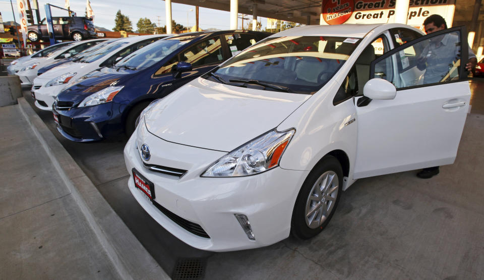 An employee parks a Toyota gas-electric hybrid automobile in a row of similar cars at a dealership in Los Angeles Thursday, Jan. 26, 2012. (Photo: ASSOCIATED PRESS)