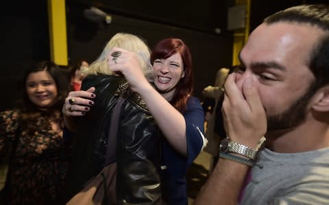 Yes campaigners hug one another as the count in the Irish referendum on the 8th amendment concerning the country's abortion laws takes place at the RDS centre