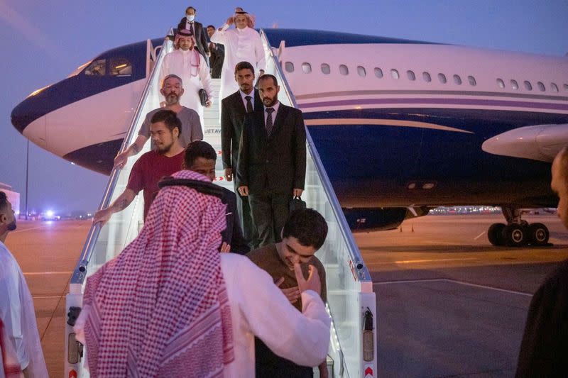 FILE PHOTO: A plane carrying 10 prisoners of war (five British citizens, one Moroccan, one Swede, one Croat, and two Americans) are seen arriving, following successful mediation efforts by Saudi ArabiaÕs Crown Prince Mohammed bin Salman, from Russia to Ki