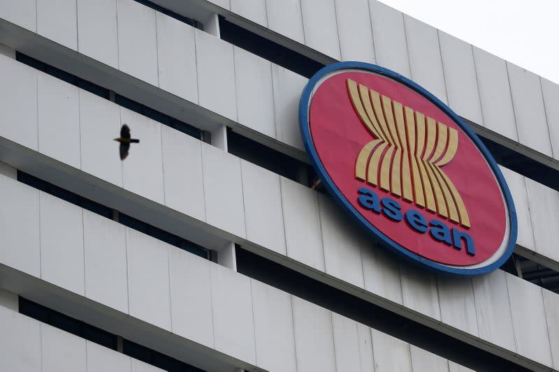 FILE PHOTO: A bird flies near ASEAN secretariat building ahead of the summit in Jakarta