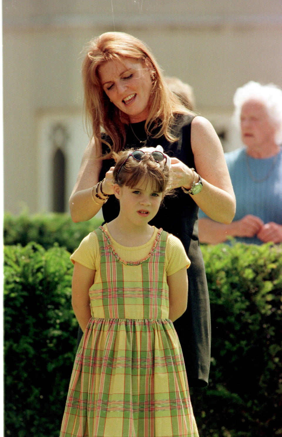 Princess Eugenie at eight with her mother. (PA Images)