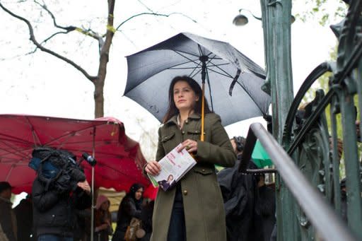 Cecile Duflot, leader of France's Green party Europe-Ecologie-Les Verts (EELV), hands out leaflets supporting Francois Hollange outside a Metro station in Paris. Hollande has been attacked by the right for his plan to give foreign residents the vote in local elections