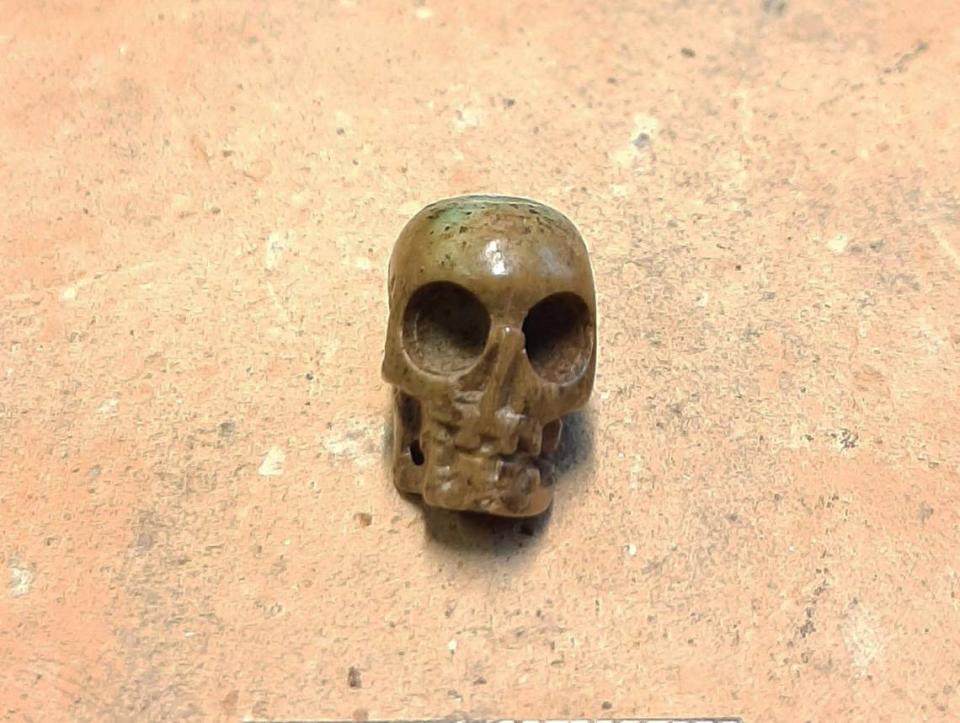 A rare and unusual skull-shaped artifact made of bone was discovered, archaeologists said.