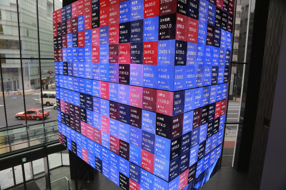 An electronic stock board is displayed at a conference hall in Tokyo, Wednesday, Oct. 27, 2021. Asian stock markets fell Wednesday after Australian inflation increased, highlighting global pressure for prices to rise, while investors looked ahead to U.S. economic growth data due out this week. (AP Photo/Koji Sasahara)