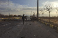 This photo released by the semi-official Fars News Agency shows the scene where Mohsen Fakhrizadeh was killed in Absard, a small city just east of the capital, Tehran, Iran, Friday, Nov. 27, 2020. Fakhrizadeh, an Iranian scientist that Israel alleged led the Islamic Republic's military nuclear program until its disbanding in the early 2000s was “assassinated” Friday, state television said. (Fars News Agency via AP)