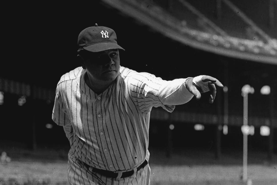 FILE - New York Yankee outfielder Babe Ruth is shown in a posed pitching stance at Yankee Stadium in New York, in this 1933 file photo. Two-way phenom Shohei Ohtani (3-1, 2.58 ERA), who leads the majors with 28 home runs, makes his first pitching appearance at Yankee Stadium when he starts for the Los Angeles Angels against New York. Ohtani is set to become the first pitcher to start one game after hitting two home runs for his team since Yankees great Babe Ruth on Sept. 28, 1930. (AP Photo/File)