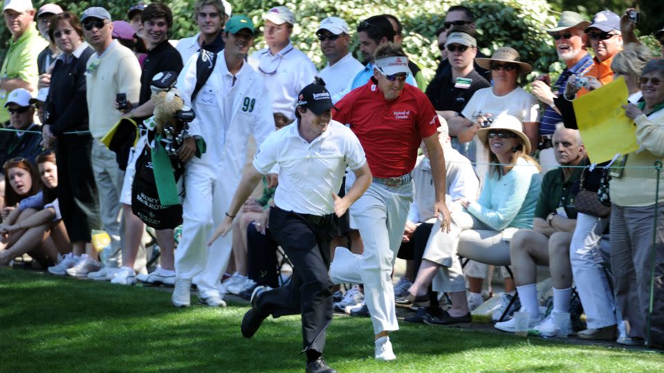 McIlroy (L) races England's Ian Poulter (R) during the Par 3 Contest prior to the 2011 Masters. - Harry How / Getty Images