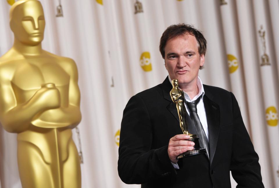 Quentin Tarantino with his award for best original screenplay for "Django Unchained" at the 2013 Oscars.