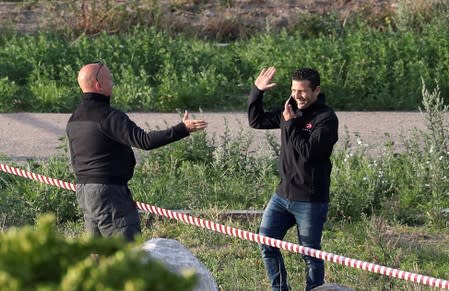 French inventor Zapata greets an unidentified man before taking off on a second attempt to cross the English channel from Sangatte