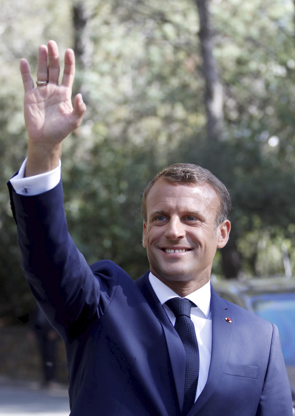 French President Emmanuel Macron waves as he arrives for a ceremony marking the 75th anniversary of the WWII Allied landings in Provence, in Saint-Raphael, southern France, Thursday, Aug. 15, 2019. Starting on Aug. 15, 1944, French and American troops — 350,000 in total — landed on the French Riviera. U.S. forces drove north while French troops — many from French colonies in Africa — moved along the coast to secure key ports. (Eric Gaillard/POOL via AP)