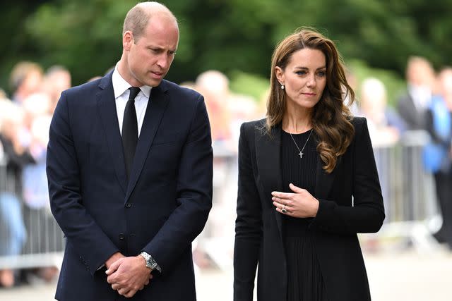 <p>Karwai Tang/WireImage</p> Prince William and Kate Middleton tour floral tributes left at Sandringham on Sept. 15, 2022, following the death of Queen Elizabeth.