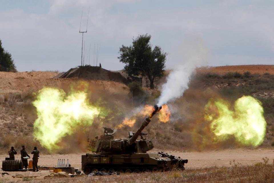 An Israeli mobile artillery unit fires towards the Gaza Strip July 18, 2014