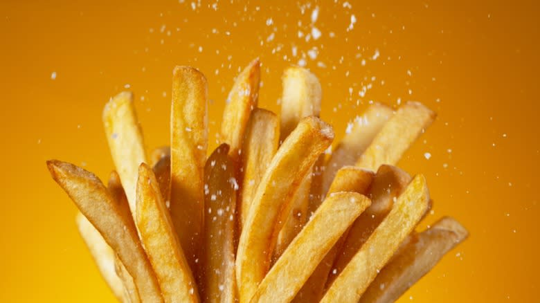 Salt sprinkled on crispy fries