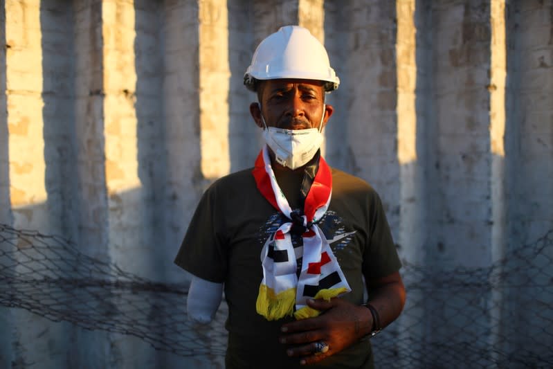 Haider Khalaf Mahmoud, an Iraqi demonstrator, poses for a photograph during the ongoing anti-government protests in Baghdad