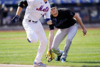 Miami Marlins starting pitcher Trevor Rogers, right, fields and infield single hit by New York Mets' Jacob deGrom, left, in the sixth inning of a baseball game, Saturday, April 10, 2021, in New York. (AP Photo/John Minchillo)