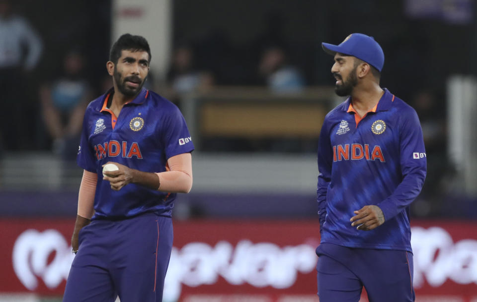 India's Jasprit Bumrah, left, talks to India's KL Rahul during the Cricket Twenty20 World Cup match between New Zealand and India in Dubai, UAE, Sunday, Oct. 31, 2021. (AP Photo/Aijaz Rahi)