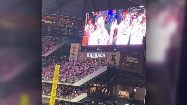 Creed band members at ALCS Game 3 in Texas Rangers gear