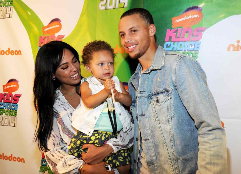 Ayesha Alexander, Riley Curry and NBA player Stephen Curry (L-R) attend Nickelodeon Kids' Choice Sports Awards 2014 at UCLA's Pauley Pavilion on July 17, 2014 in Los Angeles, California