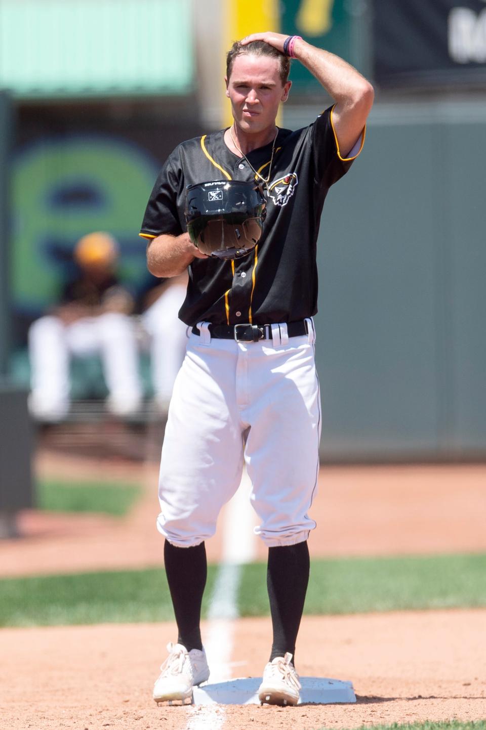 Erie SeaWolves outfielder Kerry Carpenter adjusts his helmet after reaching third base against the Harrisburg Senators on May 31, 2022, at UPMC Park in Erie. The  SeaWolves won 11-3.