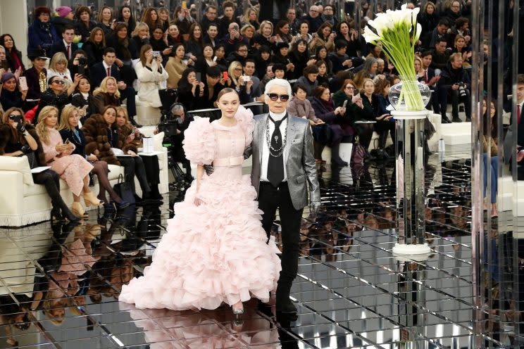 Designer Karl Lagerfeld walks the runway with Lily Rose Depp. (Photo: Getty Images) 