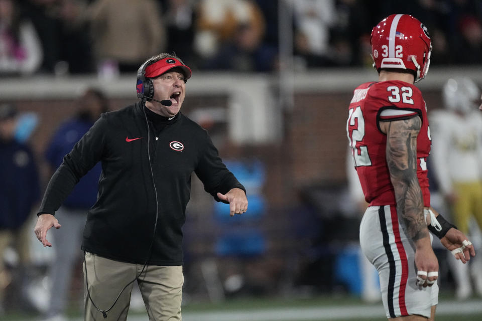 Georgia head coach Kirby Smart yells to linebacker Chaz Chambliss (32)during the first half of an NCAA college football game against Georgia Tech, Saturday, Nov. 25, 2023, in Atlanta. (AP Photo/John Bazemore)