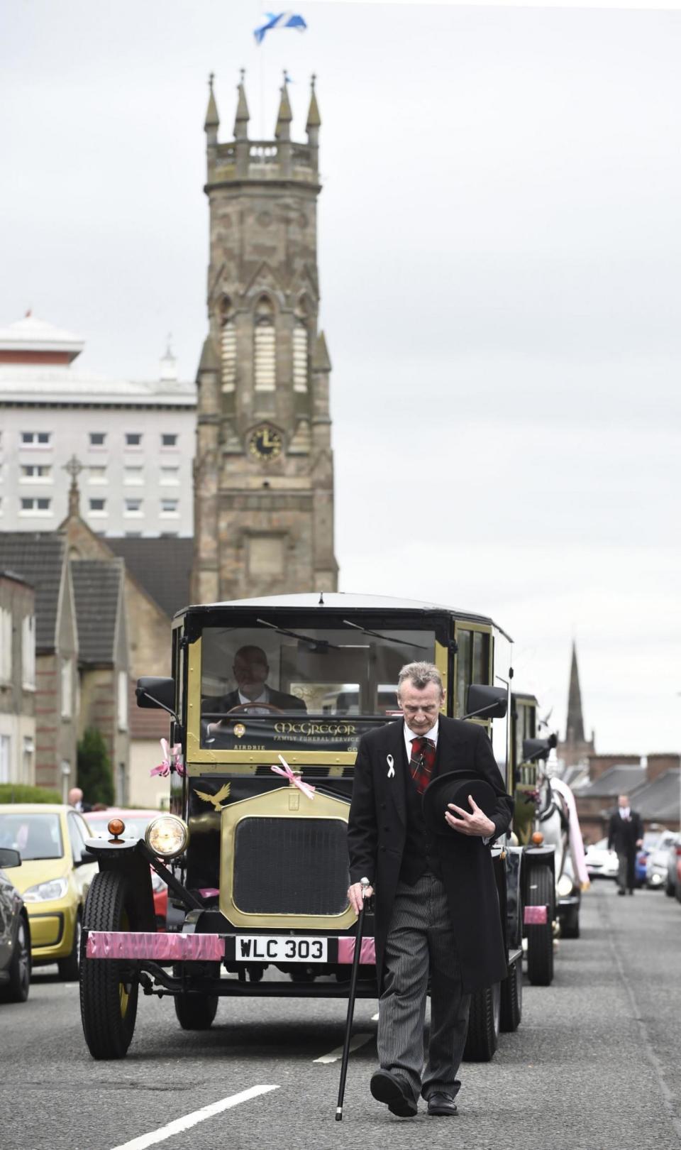 Procession: the funeral cortege arrives at the Coats Funeral Home, in Coatbridge (PA)