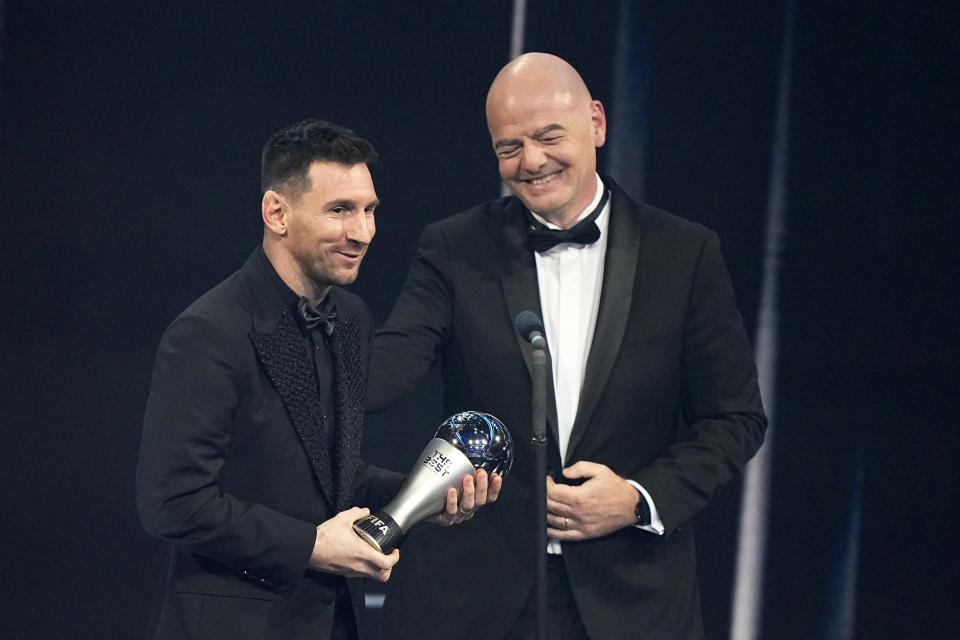 Argentina's Lionel Messi, left, receives the Best FIFA Men's player award from FIFA president Gianni Infantino during the ceremony of the Best FIFA Football Awards in Paris, France, Monday, Feb. 27, 2023. (AP Photo/Michel Euler)