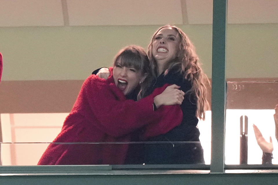 Taylor Swift, left, reacts with Brittany Mahomes during the second half of an NFL football game between the Kansas City Chiefs and Green Bay Packers, Sunday, Dec. 3, 2023 in Green Bay, Wis. (AP Photo/Morry Gash)