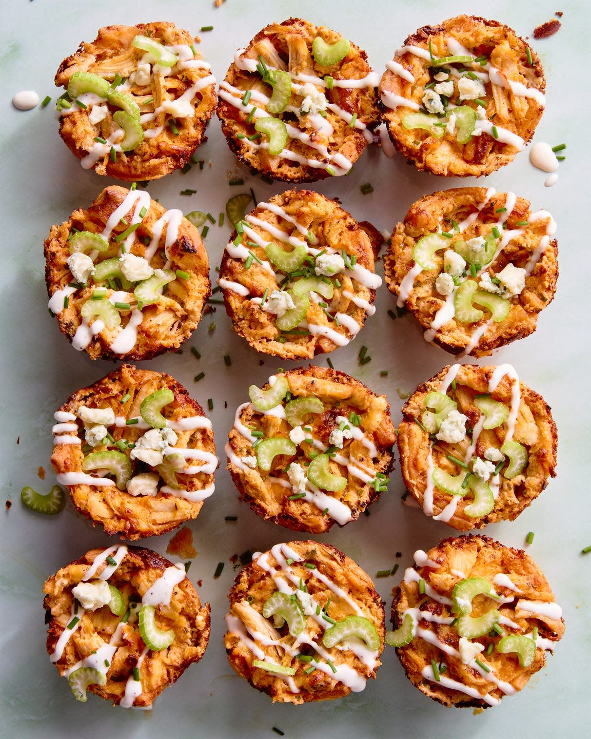 classic buffalo chicken dip with chopped chicken, cream cheese, cheddar, blue cheese, hot sauce, and chives baked into a crisp puff pastry shell until bubbling and golden