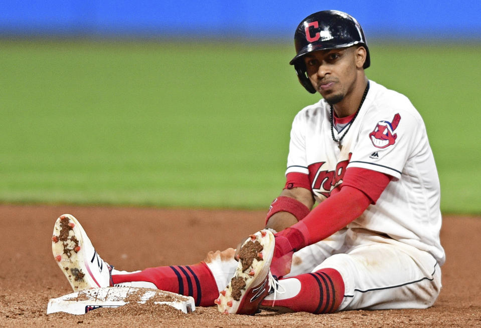 Cleveland Indians shortstop Francisco Lindor sits near second base after being forced out in Friday's game. The Indians 22-game winning streak would be snapped by the Royals. (AP)