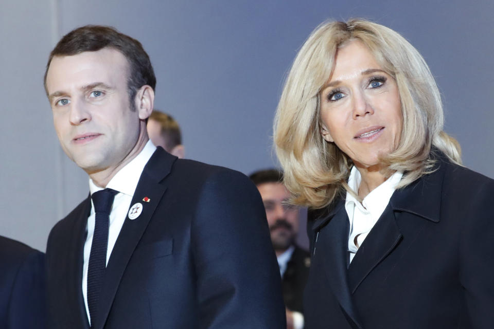 France's President Emmanuel Macron and his wife Brigitte Macron pose during the 34rd annual dinner of the group CRIF, Representative Council of Jewish Institutions of France, in Paris, Wednesday, Feb. 20, 2019. (AP Photo/Thibault Camus)