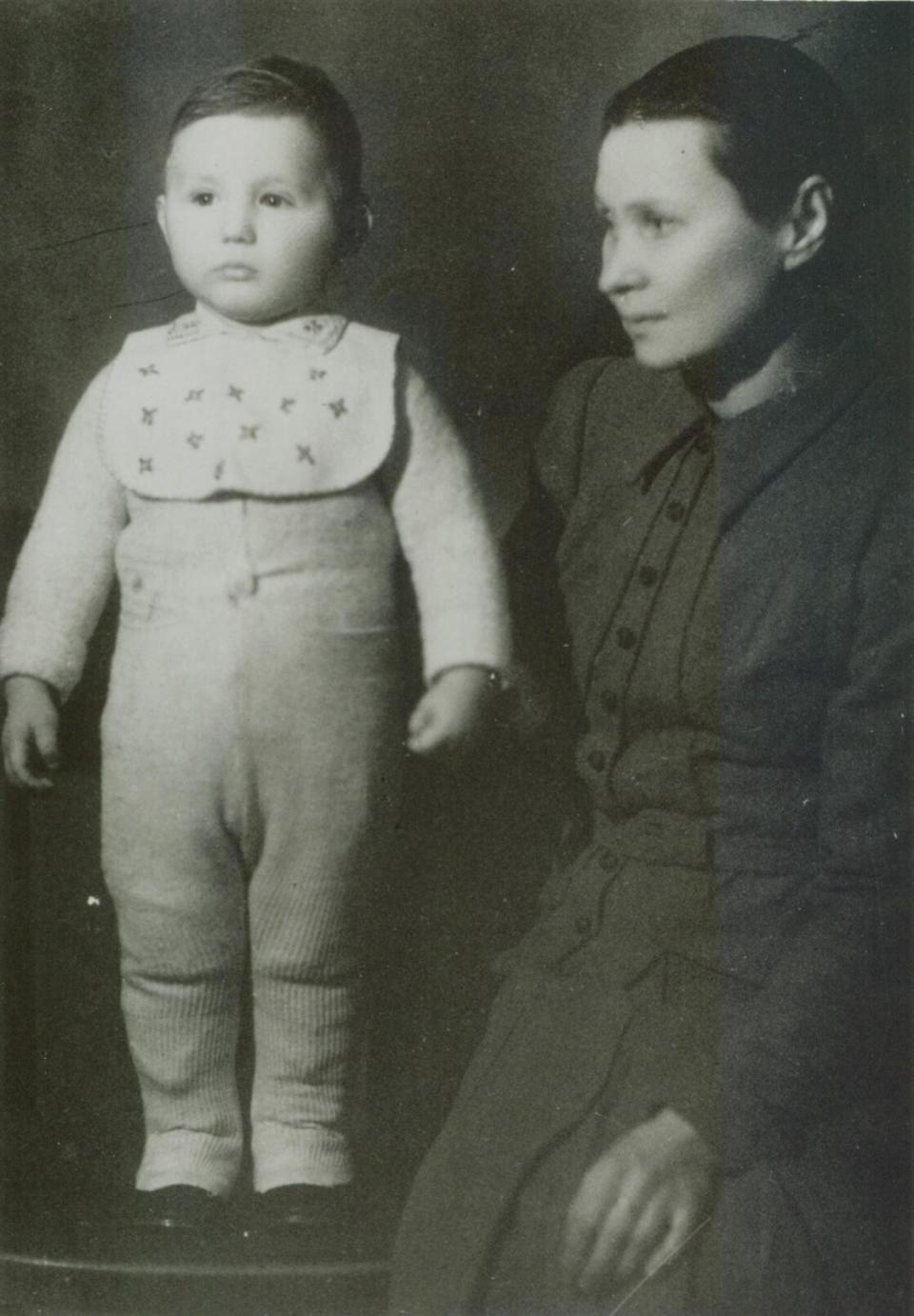 In this September 1941 photo, Holocaust survivor Abe Foxman stands for a portrait with his Polish Catholic nanny, Bronislawa Kurpitaken, in Vilnius, Lithuania. Foxman's parents left him with Kurpitaken in 1941 when they were ordered by Germans to enter a ghetto. Foxman was baptized and given the Christian name of Henryk Stanislaw Kurpi, and raised as a Catholic in Vilnius between 1941 and 1944 when he was returned to his parents. He later became the head of the ADL – a position he held for nearly 50 years. (Abe Foxman via AP)