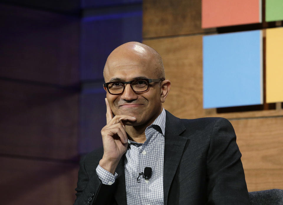 FILE - In this Wednesday, Nov. 30, 2016, file photo, Microsoft CEO Satya Nadella listens to a question at the annual Microsoft shareholders meeting in Bellevue, Wash. Nadella has written an autobiography recounting his efforts to transform the technology company with a focus on empathy and changing its workplace culture. The book, “Hit Refresh,” also reveals some personal challenges, such as his risky move to switch his green card to a temporary work visa in the 1990s so that his wife could join him in the United States. (AP Photo/Elaine Thompson, File)