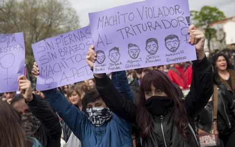 People shout slogans and hold banners during a demonstration against the verdict of the 'Wolf Pack' gang rape case in 2018 - Credit: Gari Garaialde/Getty Images