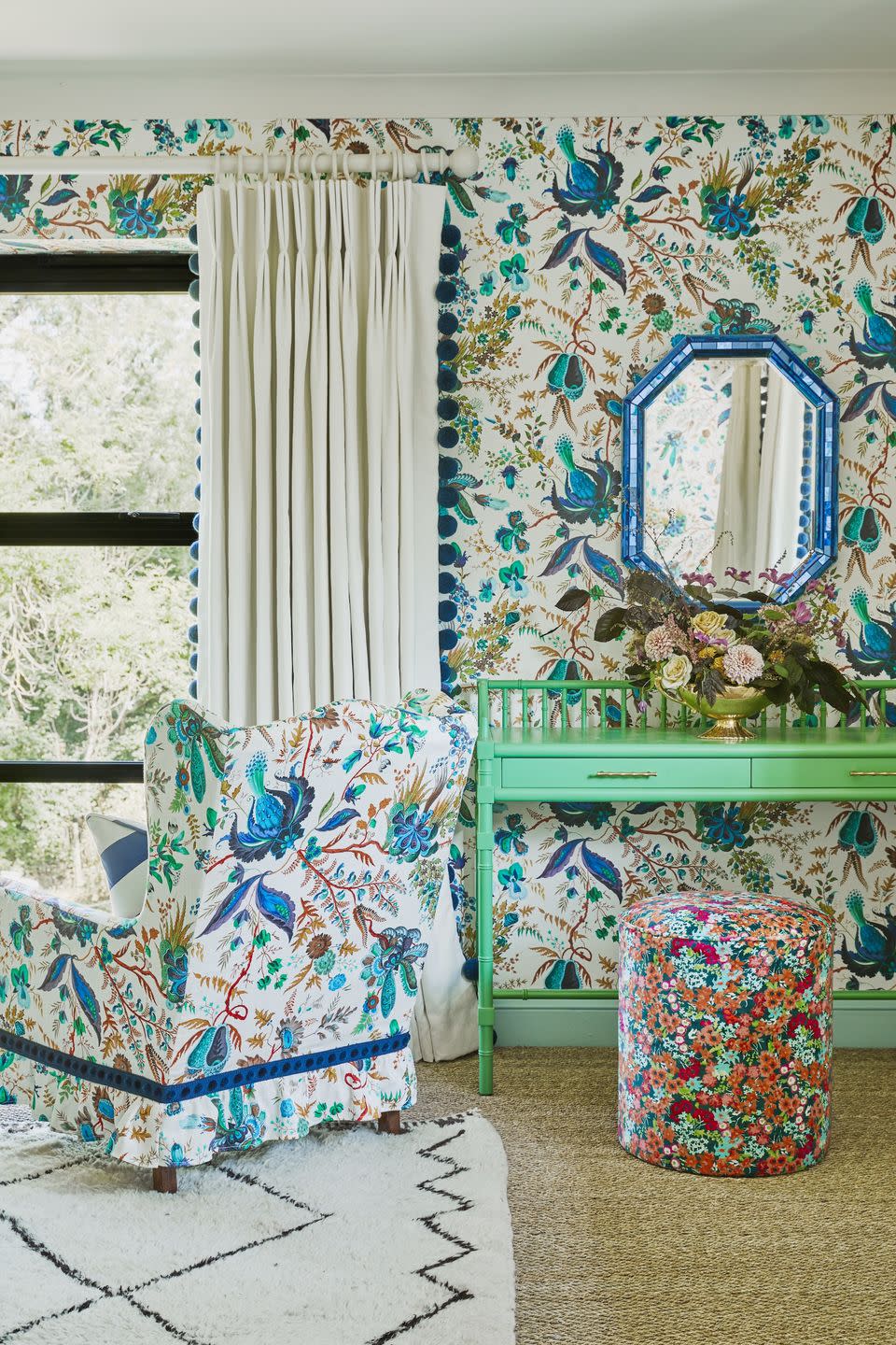 a colourful pattern clash maximalist bedroom with a bed and a chair