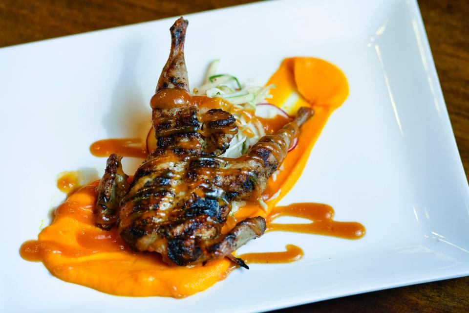 Seth Sparks, executive chef at Northampton Wine Cafe, created a grilled quail dish, new to the Spring menu, photographed on Friday, March 30.