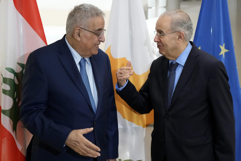 Cyprus' foreign minister Ioannis Kasoulides, right, talks with his Lebanese counterpart Abdallah Bou Habib before their meeting at the foreign ministry house in Nicosia, Cyprus, Friday, April 15, 2022. Bouhabib is in Cyprus for one-day visit. (AP Photo/Petros Karadjias)