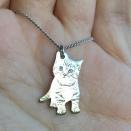 <p>ilovemypetmorethanyou.com</p><p><strong>$39.99</strong></p><p><a href="https://ilovemypetmorethanyou.com/collections/jewelry/products/engraved-silver-pet-photo-necklace" rel="nofollow noopener" target="_blank" data-ylk="slk:Shop Now;elm:context_link;itc:0;sec:content-canvas" class="link ">Shop Now</a></p><p>If you’ve ever thought, “Wow, there is no one more obsessed with their pet than my girlfriend,” then this is a great purchase. You can get their pet’s photo turned into a necklace charm, the brand donates a portion of each sale to an animal rescue, and yes, they will love you forever.</p>