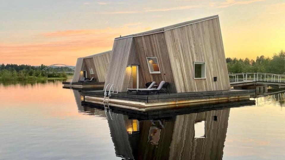 a wooden house on a dock