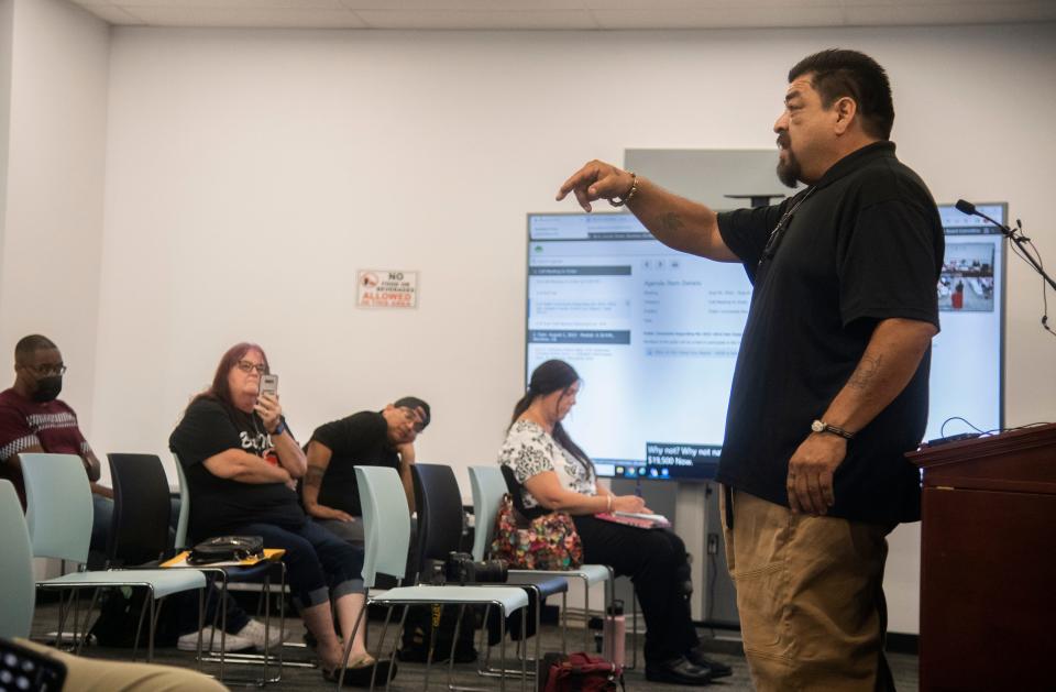 Area resident Rafael Cardoza turns and addresses the audience as he makes his remarks during public comment at a town hall meeting about the critical grand jury report at the SUSD headquarters in downtown Stockton. 