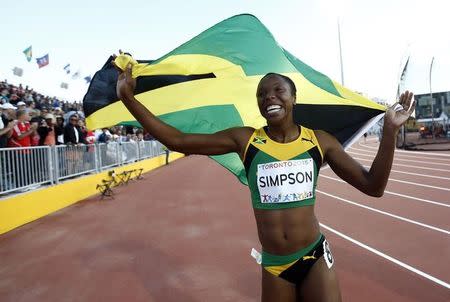 Jul 22, 2015; Toronto, Ontario, CAN; Sherone Simpson of Jamaica celebrates after winning the women's athletics 100m final during the 2015 Pan Am Games at CIBC Pan Am Athletics Stadium. Mandatory Credit: Rob Schumacher-USA TODAY Sports