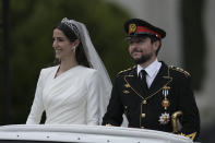 Jordan's Crown Prince Hussein and Saudi Rajwa Alseif leave Zahran Palac during their wedding ceremonies on Thursday, June 1, 2023, in Amman, Jordan. (AP Photo/Nasser Nasser)