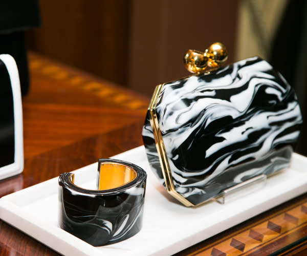 Perspex was a key ingredient in Stella's accessories - we loved this black and white swirled print clutch and cuff ©Rex