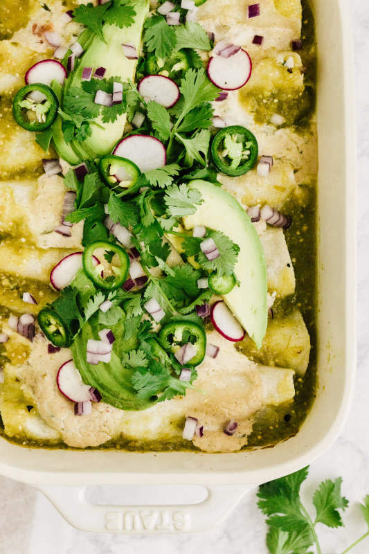 <p>Nourished by Nutrition</p><p>Healthy salsa verde chicken enchiladas with spinach made dairy-free with vegan cashew queso.</p><p><strong>Get the recipe: <a href="https://nourishedbynutrition.com/healthy-salsa-verde-chicken-enchiladas-dairy-free/" rel="nofollow noopener" target="_blank" data-ylk="slk:Healthy Salsa Verde Chicken Enchiladas (Dairy-Free);elm:context_link;itc:0;sec:content-canvas" class="link rapid-noclick-resp">Healthy Salsa Verde Chicken Enchiladas (Dairy-Free)</a></strong></p>