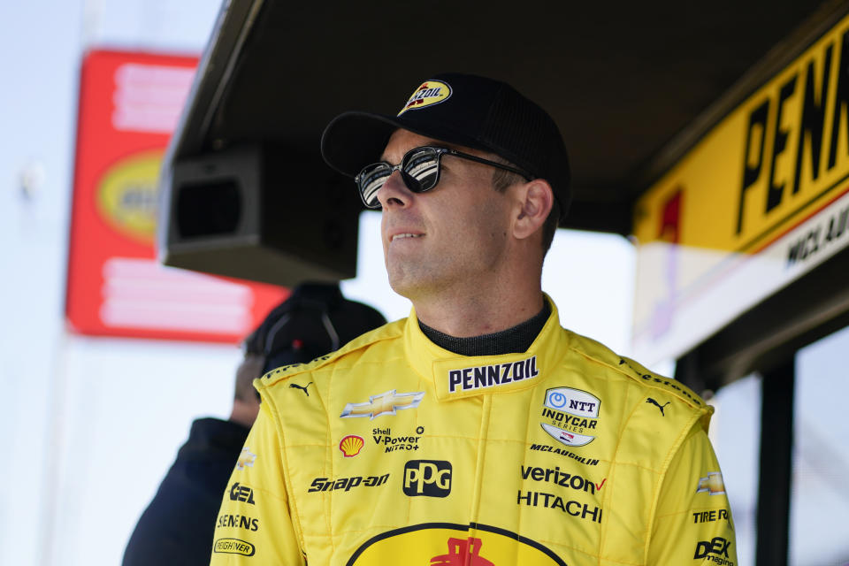 Scott McLaughlin, of New Zealand, watches from his pit box during practice for the Indianapolis 500 auto race at Indianapolis Motor Speedway, Tuesday, May 17, 2022, in Indianapolis. (AP Photo/Darron Cummings)