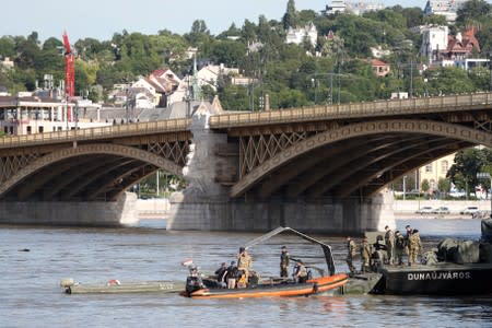 A search operations continue near the Margaret bridge on the Danube river after a boat carrying South Korean tourists capsized in Budapest